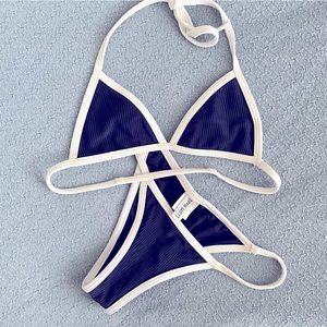 Dippin Daisy’s navy blue and white micro bikini